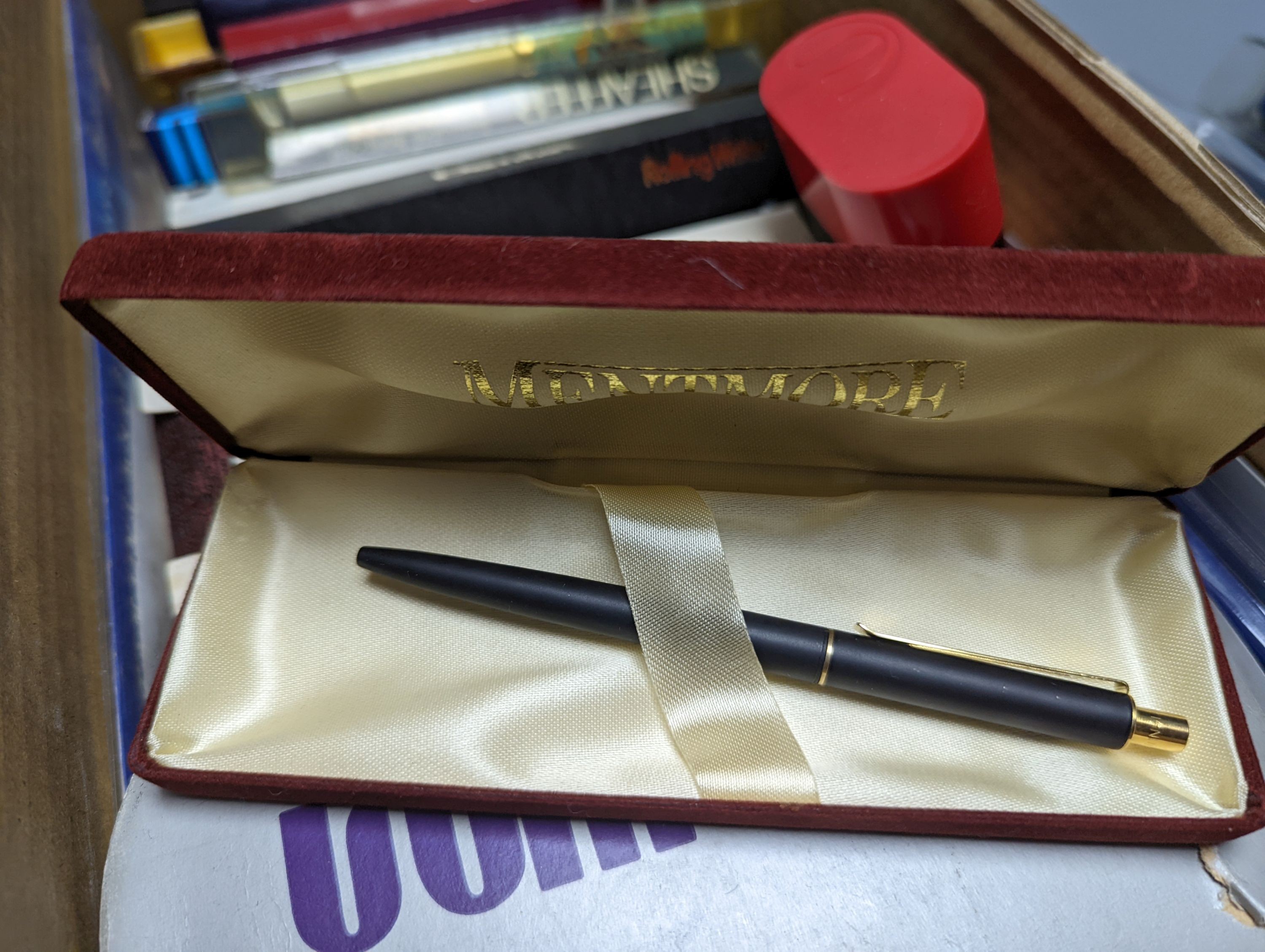 A collection of fountain pens, other pens, pencils and inks